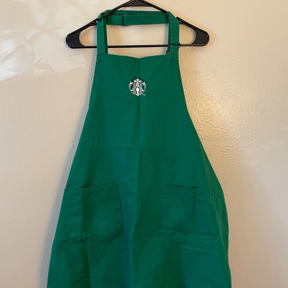 Two green Starbucks Aprons